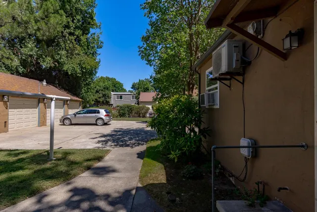 a bedroom with furniture and a flat screen tv