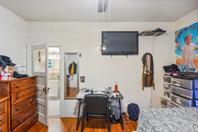 a living room with furniture ceiling fan and a rug