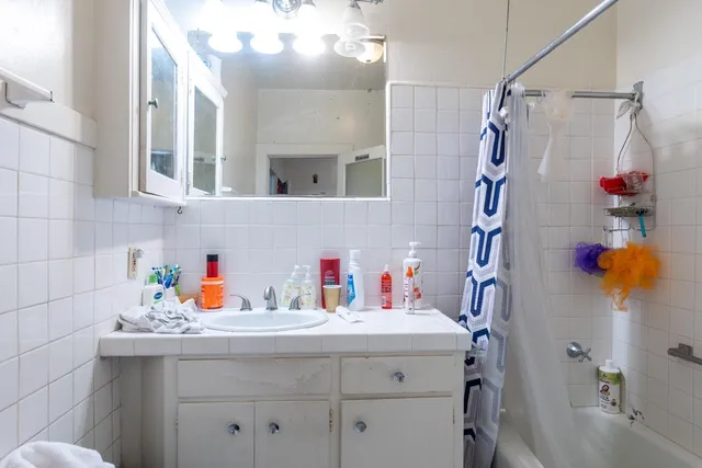 a living room with lots of furniture and a chandelier