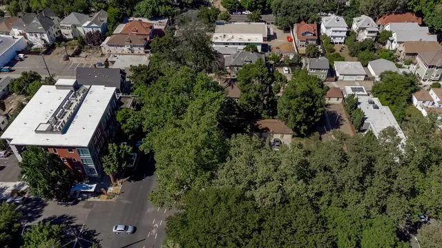 an aerial view of a house with outdoor space and street view