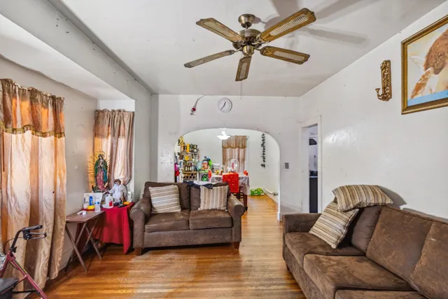 a bathroom with a granite countertop sink toilet and mirror