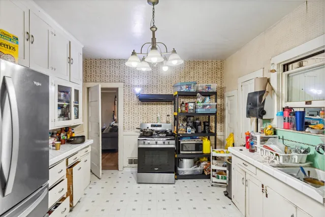 a living room with furniture a rug and a flat screen tv