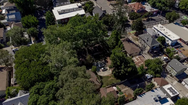 an aerial view of a house with a yard