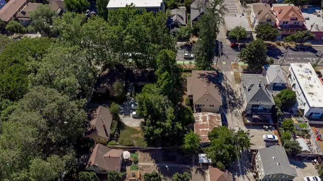 an aerial view of a house with yard swimming pool and outdoor seating