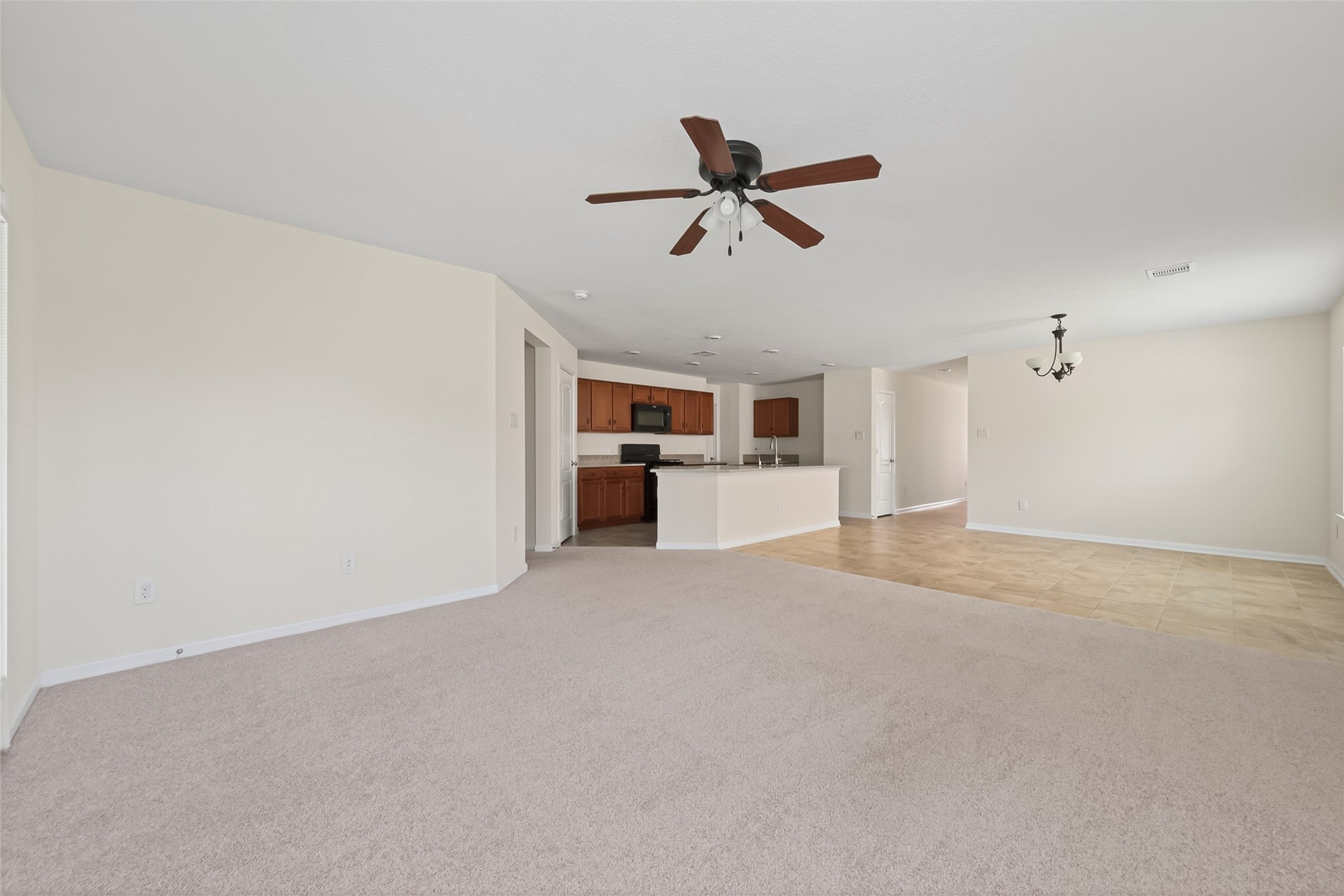 2754 Cayden Creek Way Conroe, TX 77304 - Photo 9 of 40 a view of a livingroom with a kitchen