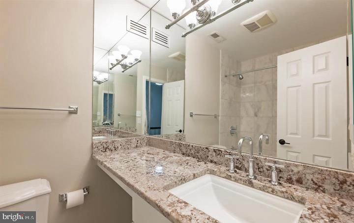 2317 37th Street Northwest Washington, DC 20007 - Photo 35 of 54 Sleek modern bathroom with elegance.