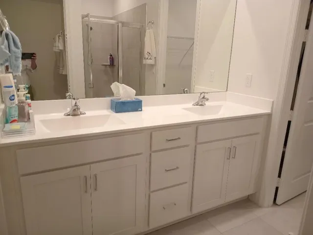 a bathroom with a sink and a mirror
