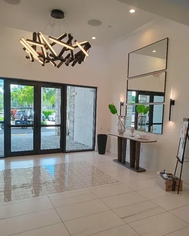 a view of a livingroom with furniture and window