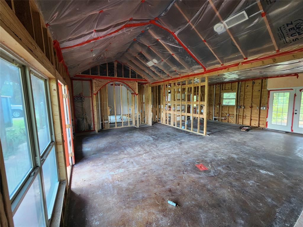 a view of an empty room with glass door
