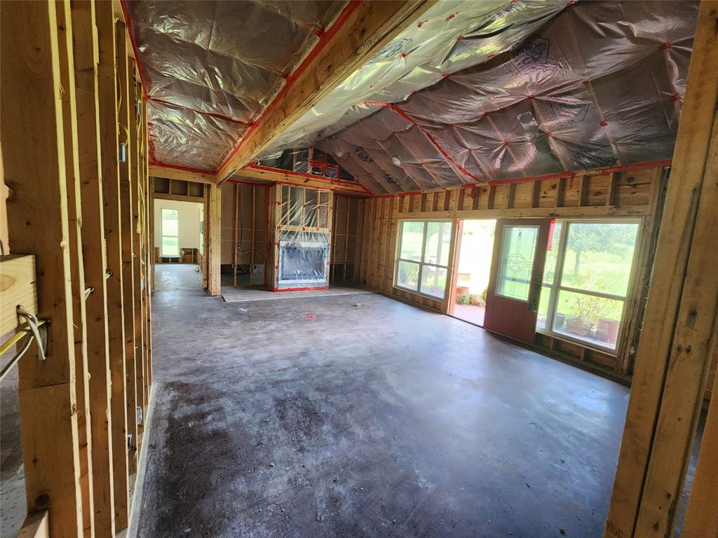 17555 County Road 330 Terrell, TX 75161 - Photo 19 of 32 a view of a hallway with a large window and chandelier