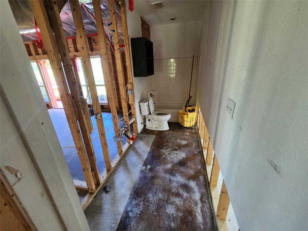 17555 County Road 330 Terrell, TX 75161 - Photo 20 of 32 a hallway with front door wooden floor and stairs