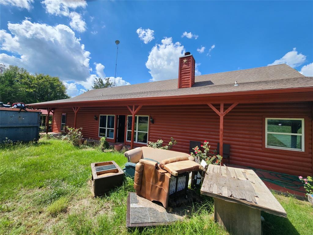 17555 County Road 330 Terrell, TX 75161 - Photo 2 of 32 a front view of house with a garden and patio