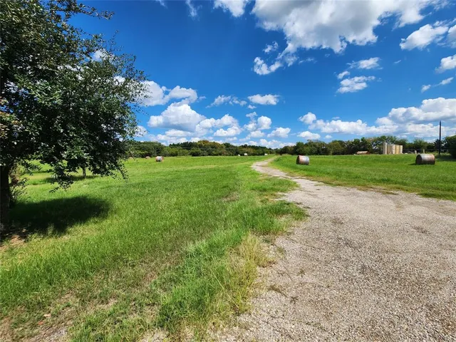 a view of a golf course with a lake