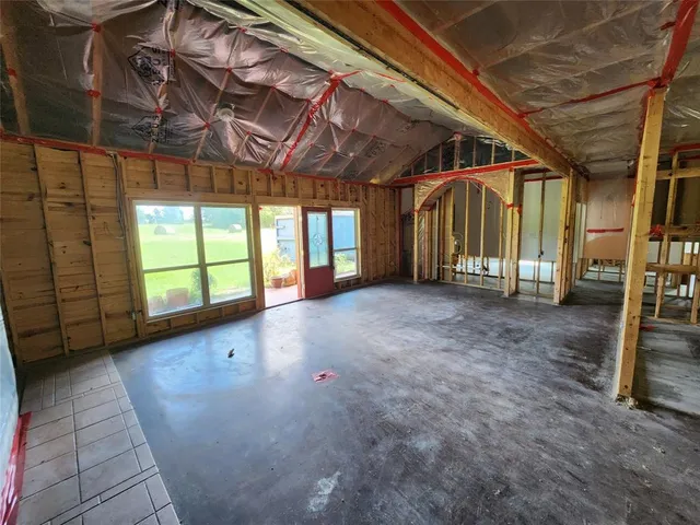 a view of a room with wooden walls