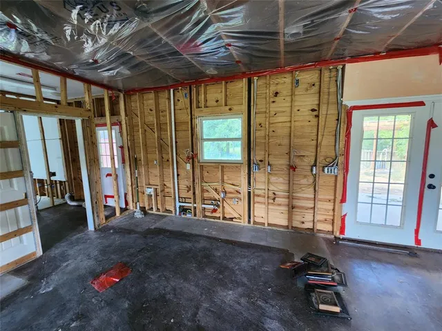 a living room with hardwood floor and furniture