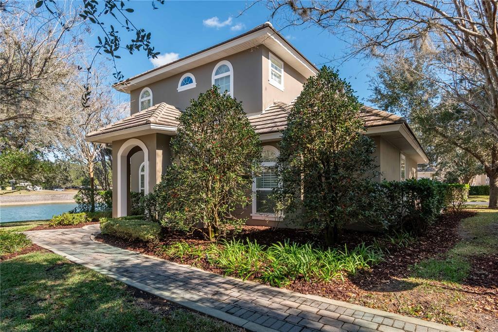 a front view of a house with garden
