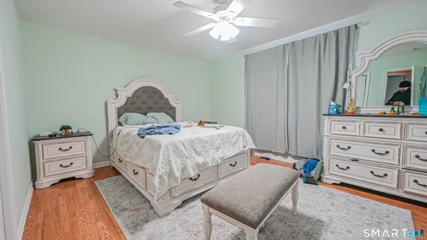 a bedroom with a bed and a dresser