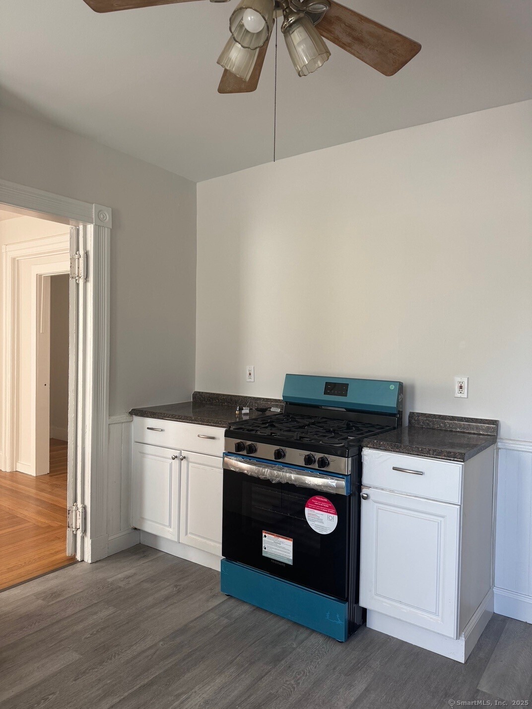 39 Maple Street New Haven, CT 06511 - Photo 2 of 10 a kitchen with a stove and a microwave