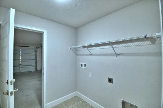 an empty room with closet area