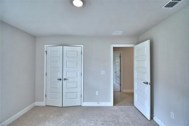 a bathroom with a granite countertop sink vanity and a mirror