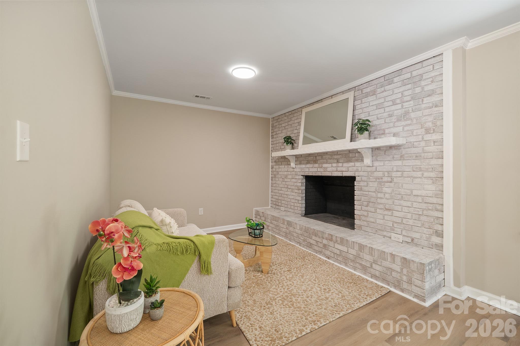 624 Flicker Street Concord, NC 28027 - Photo 12 of 47 a living room with furniture and a fireplace