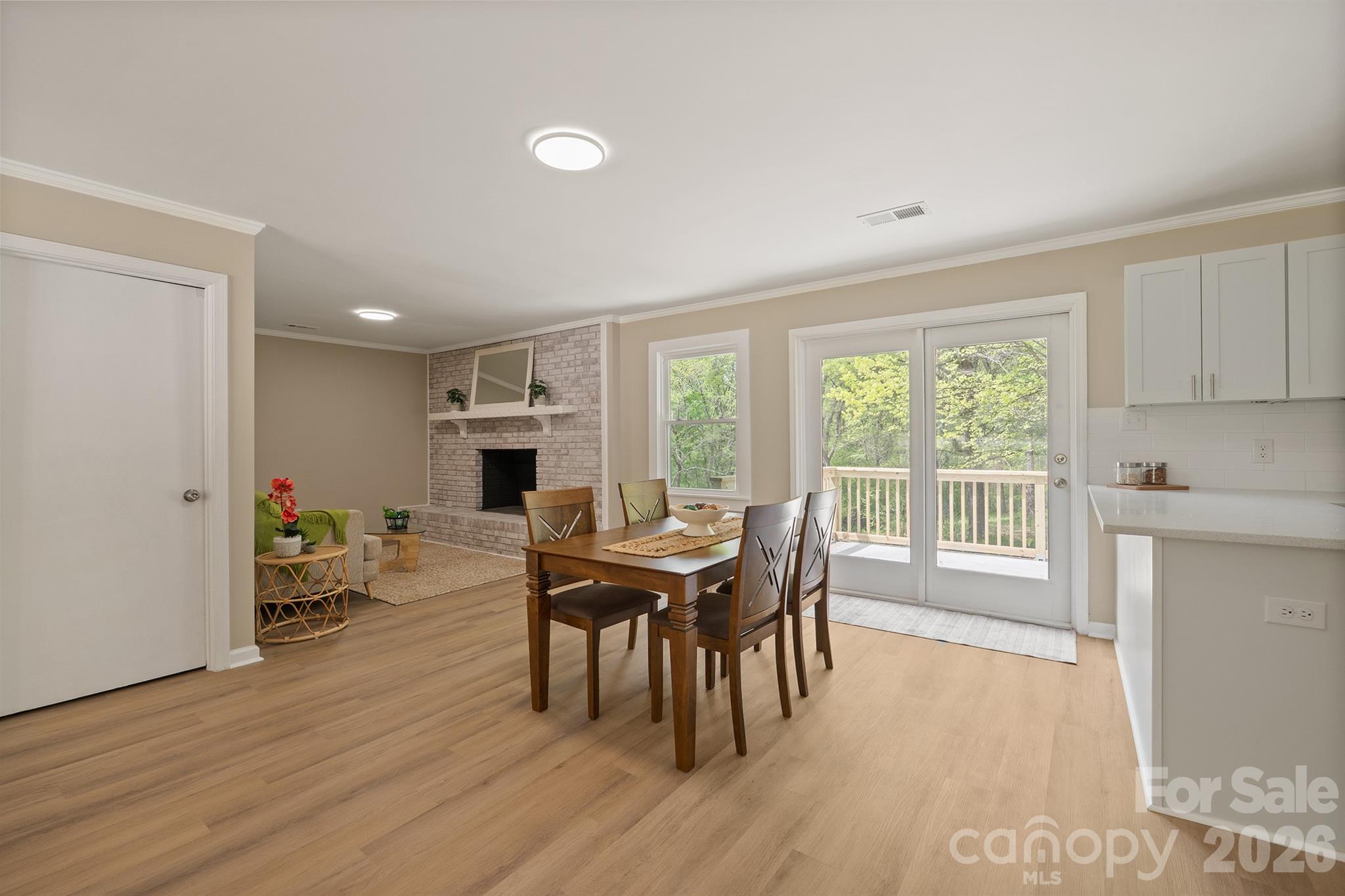 624 Flicker Street Concord, NC 28027 - Photo 14 of 47 a view of a dining room with furniture window and wooden floor