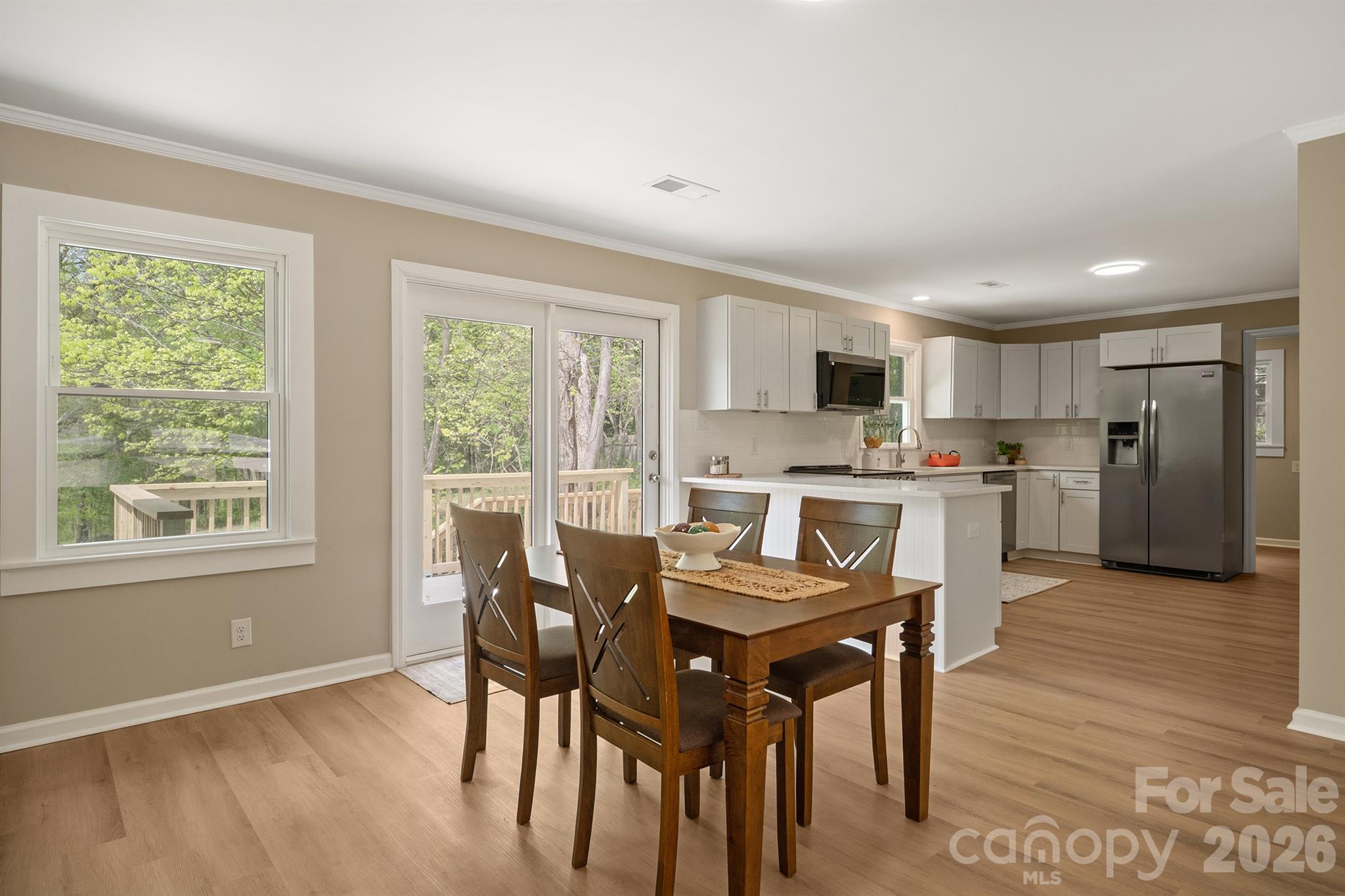 624 Flicker Street Concord, NC 28027 - Photo 15 of 47 a kitchen with a table and chairs in it