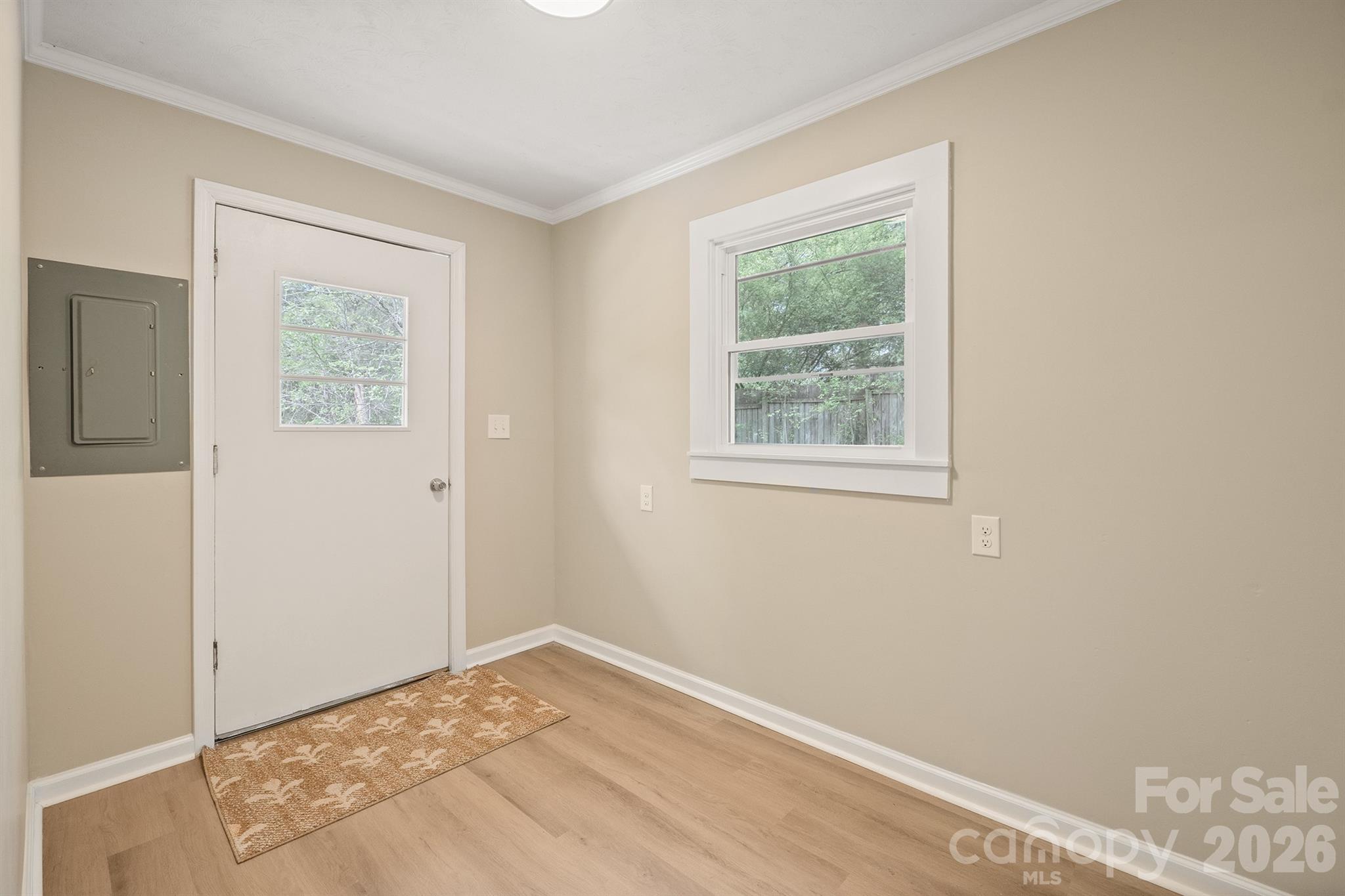624 Flicker Street Concord, NC 28027 - Photo 20 of 47 a view of a big room with wooden floor and a window
