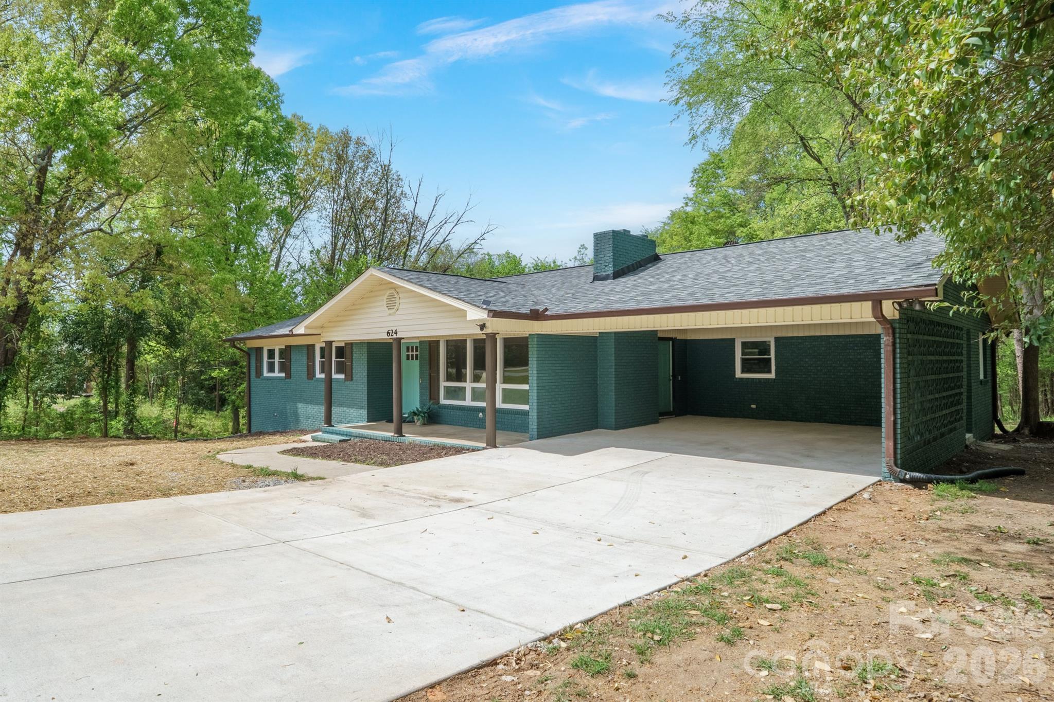 624 Flicker Street Concord, NC 28027 - Photo 2 of 47 a front view of a house with a yard and garage