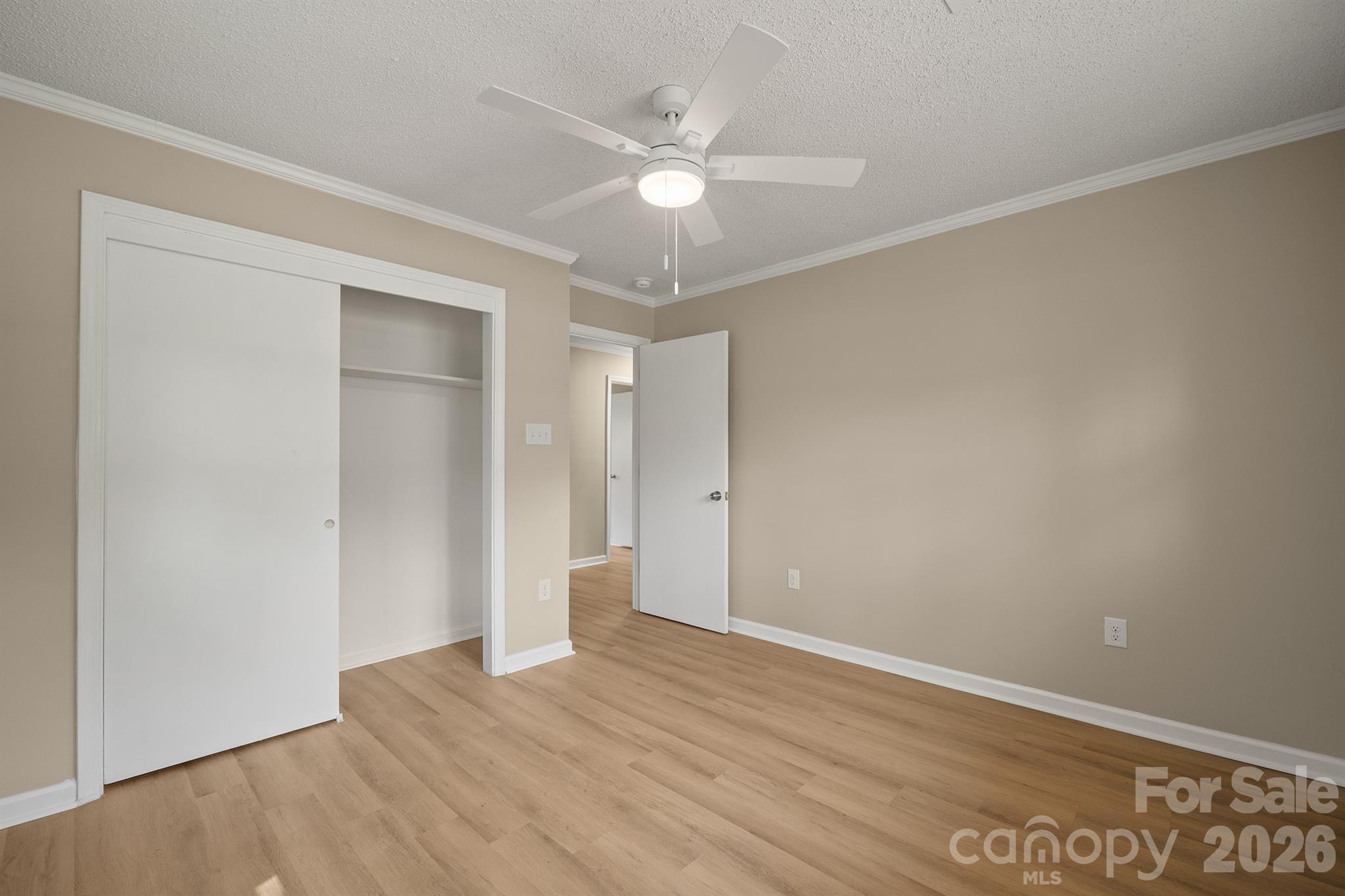 624 Flicker Street Concord, NC 28027 - Photo 22 of 47 a view of an empty room with wooden floor