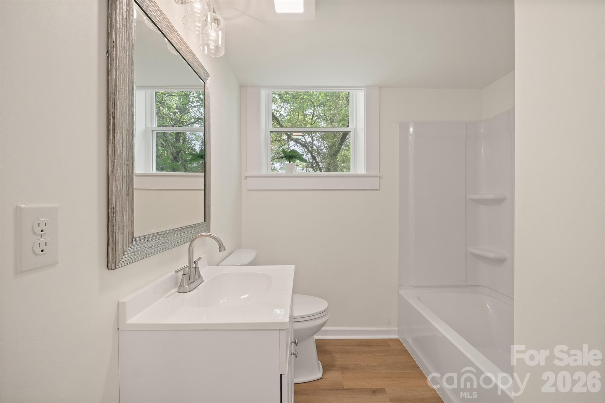 624 Flicker Street Concord, NC 28027 - Photo 28 of 47 a bathroom with a sink a toilet and tub