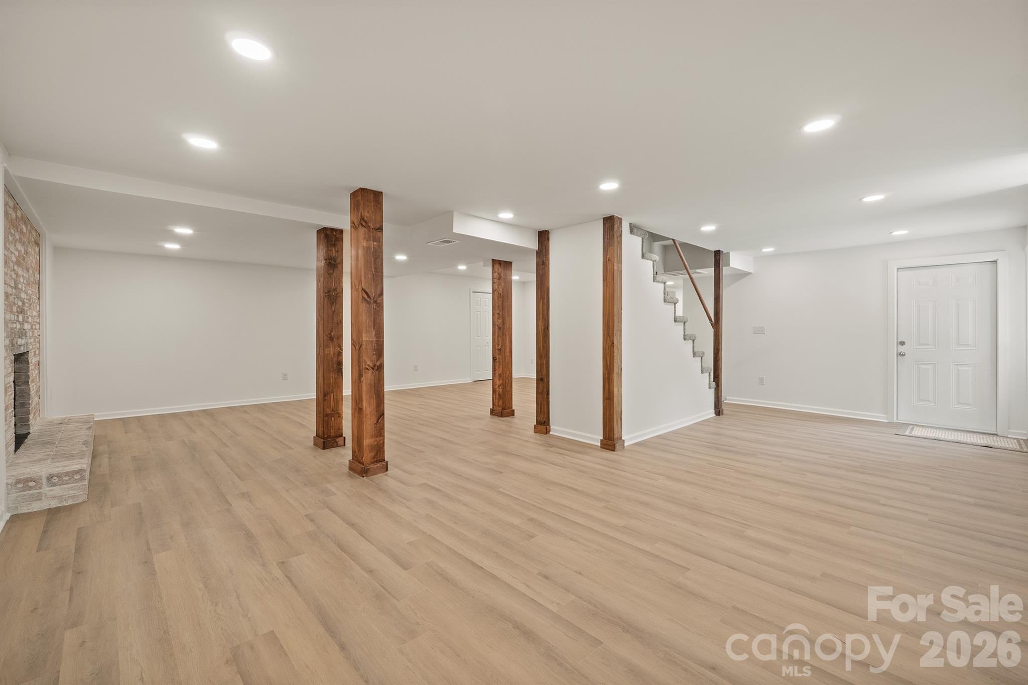624 Flicker Street Concord, NC 28027 - Photo 35 of 47 a view of an empty room with wooden floor