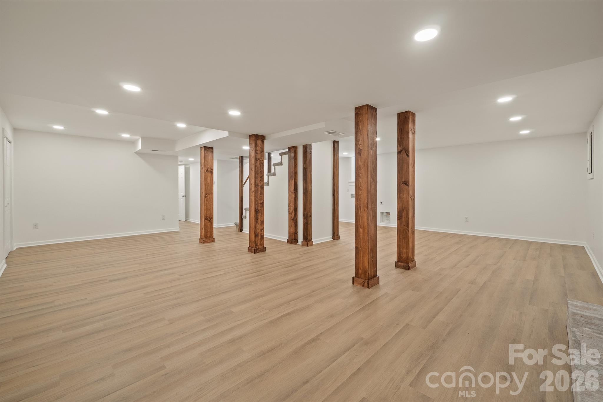 624 Flicker Street Concord, NC 28027 - Photo 36 of 47 a view of an empty room with wooden floor