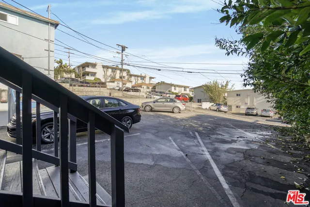 a view of a car park in front of house