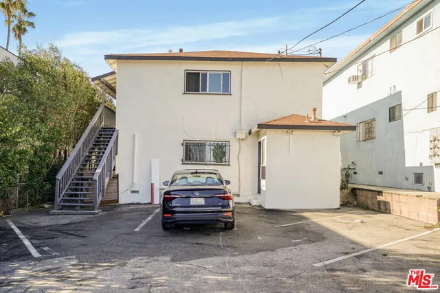 a car parked in front of a house