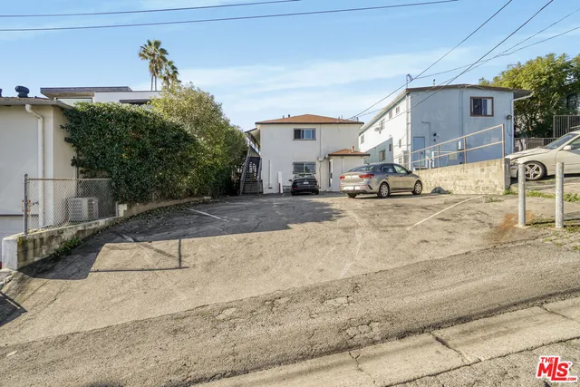 a view of house with outdoor space and sitting area