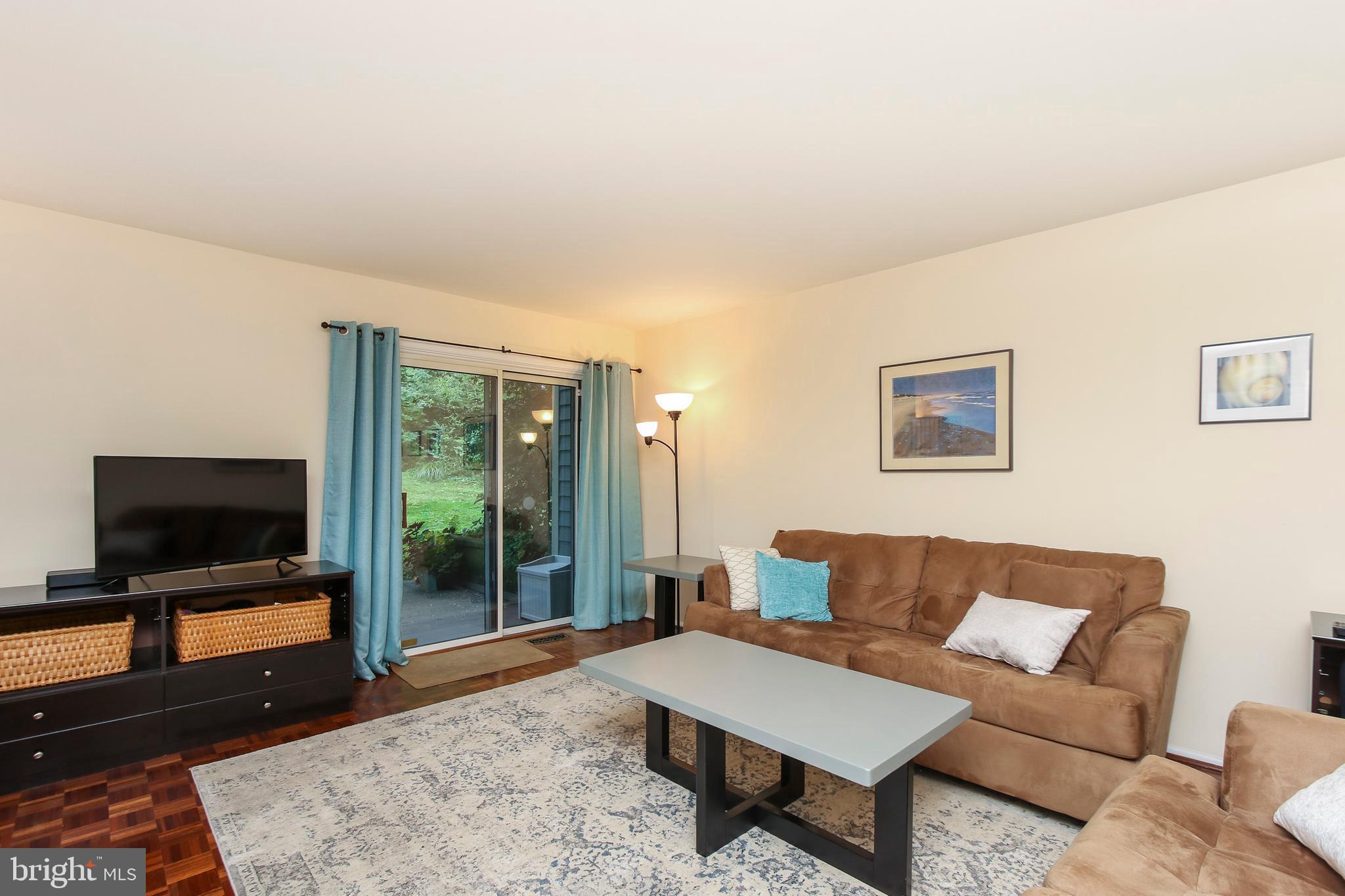 15 Stone Ridge Court, Unit 8 Baltimore, MD 21239 - Photo 11 of 39 Spacious Living Room with Hardwood Fllors