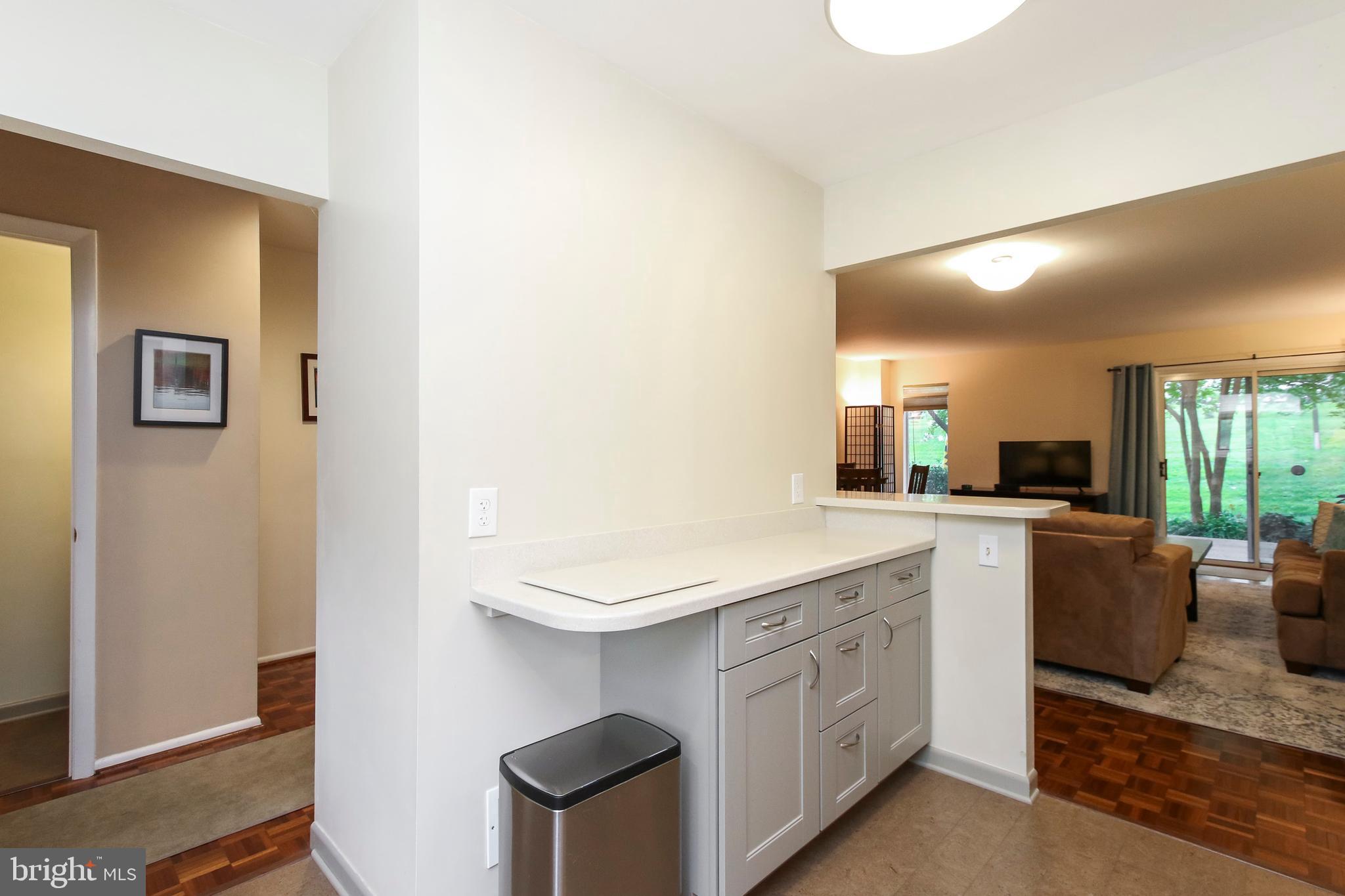 15 Stone Ridge Court, Unit 8 Baltimore, MD 21239 - Photo 9 of 39 Open Concept with Corian Breakfast to The Great Rm