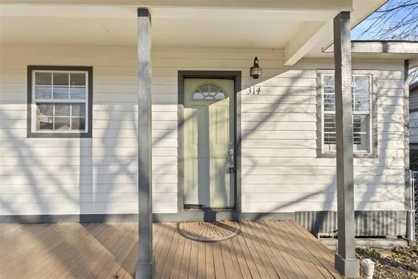 a view of a balcony with a floor to ceiling window