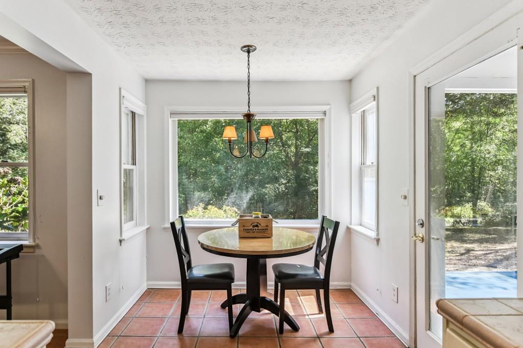 19 Normandy Court Atlanta, GA 30324 - Photo 15 of 27 a dining room with furniture window and outside view