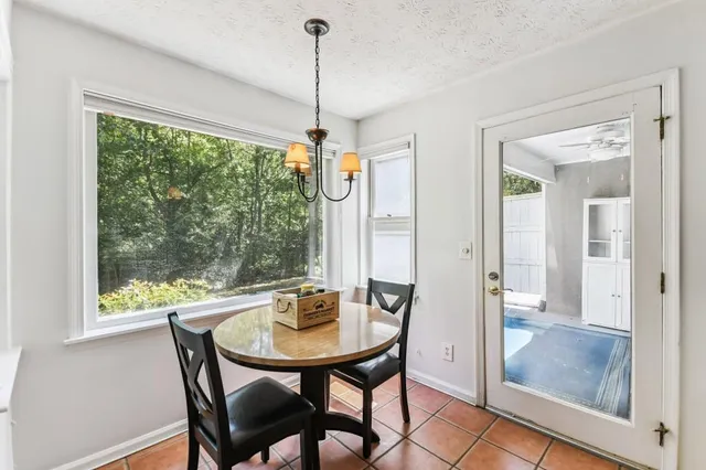 a view of a dining room with furniture window and outside view