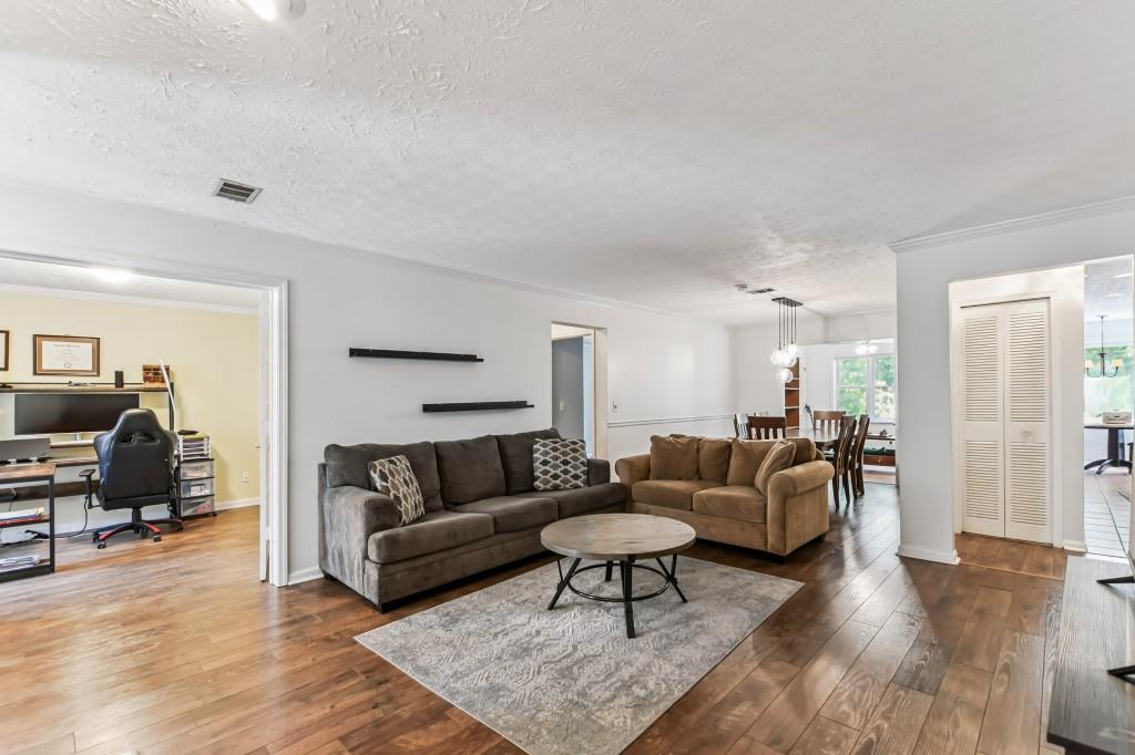 19 Normandy Court Atlanta, GA 30324 - Photo 2 of 27 a living room with furniture and a couch