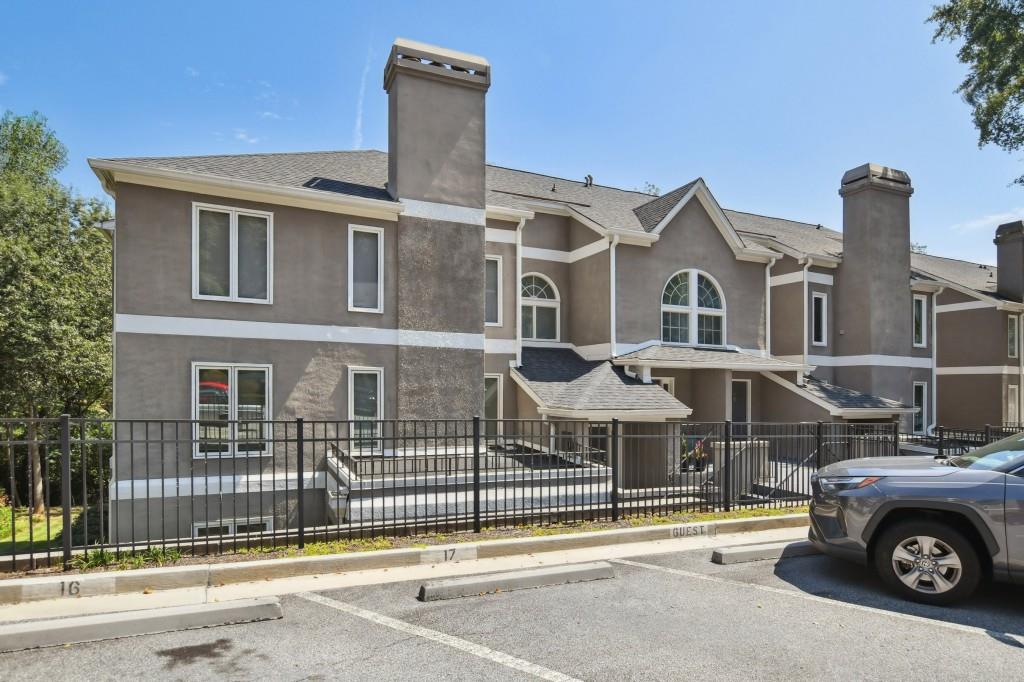 19 Normandy Court Atlanta, GA 30324 - Photo 25 of 27 a front view of a house with a parking space
