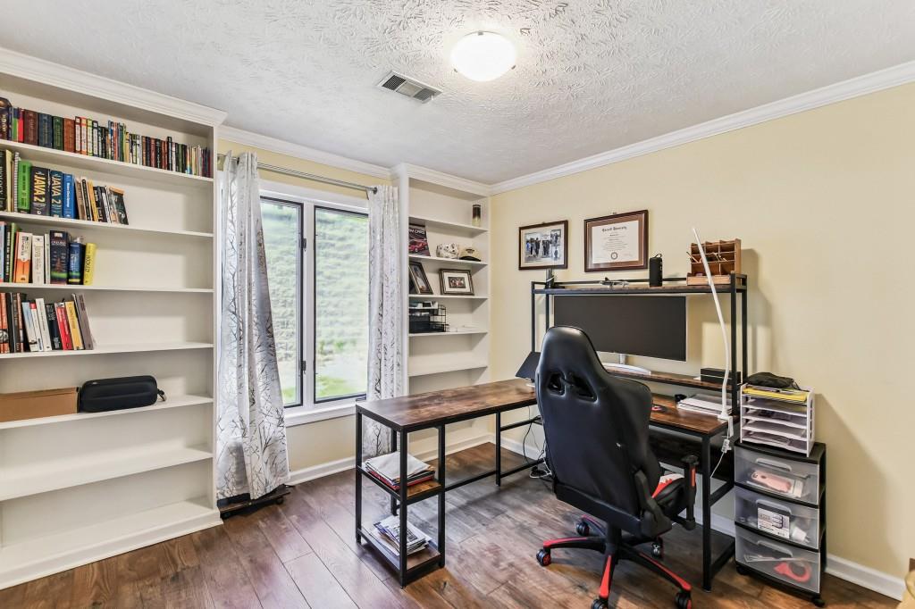 19 Normandy Court Atlanta, GA 30324 - Photo 5 of 27 a view of a workspace with furniture and a bedroom