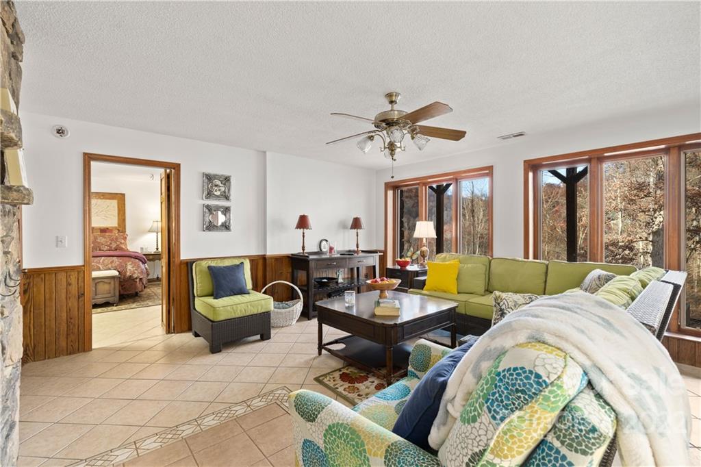 80 Lick Log Road Sylva, NC 28779 - Photo 15 of 25 a living room with furniture and a large window