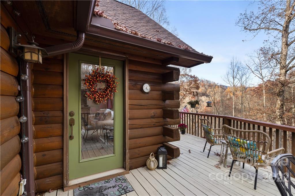 80 Lick Log Road Sylva, NC 28779 - Photo 19 of 25 a view of balcony with wooden floor and outdoor seating
