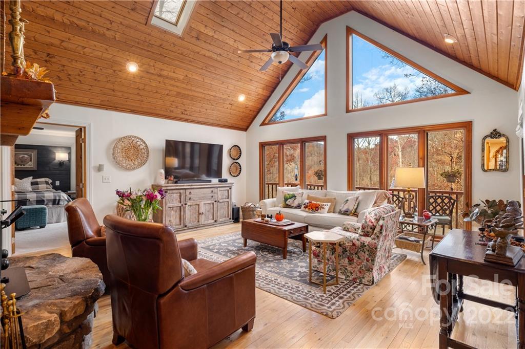 80 Lick Log Road Sylva, NC 28779 - Photo 2 of 25 a living room with furniture a large window and a rug