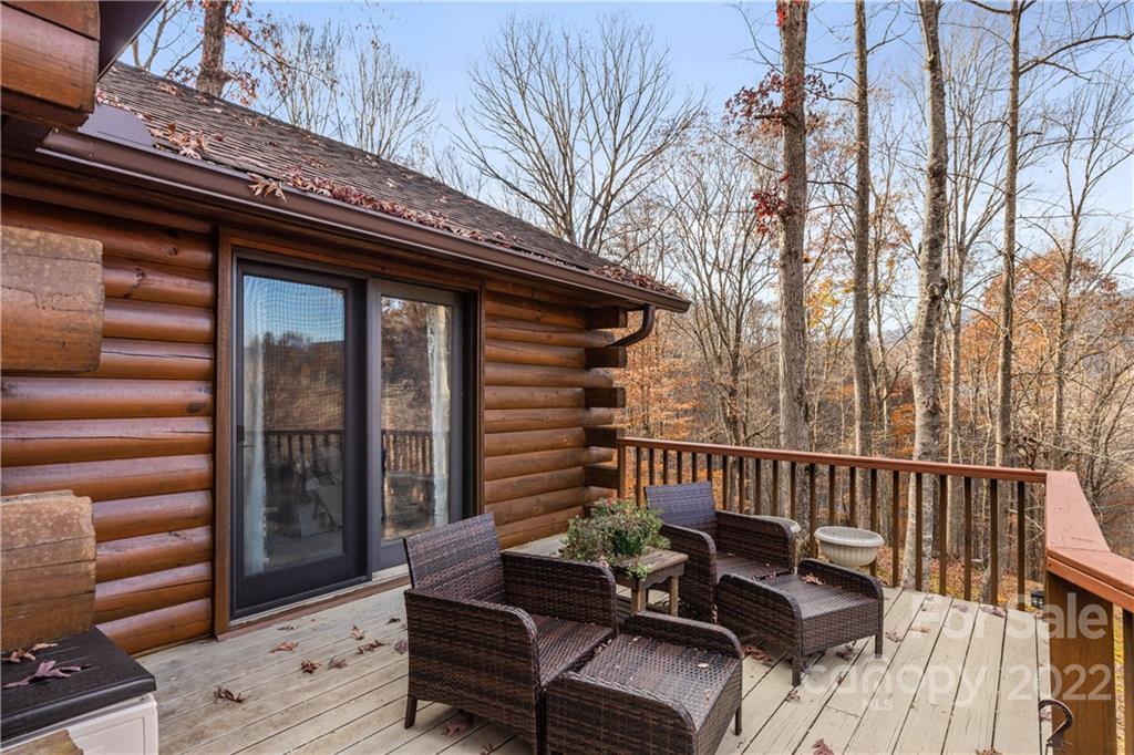 80 Lick Log Road Sylva, NC 28779 - Photo 21 of 25 a view of a two chairs in the deck