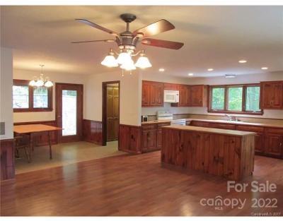 80 Lick Log Road Sylva, NC 28779 - Photo 25 of 25 a open kitchen with stainless steel appliances granite countertop a refrigerator a sink dishwasher a dining table and chairs with wooden floor