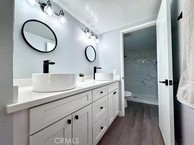 a spacious bathroom with a double vanity sink double and a mirror